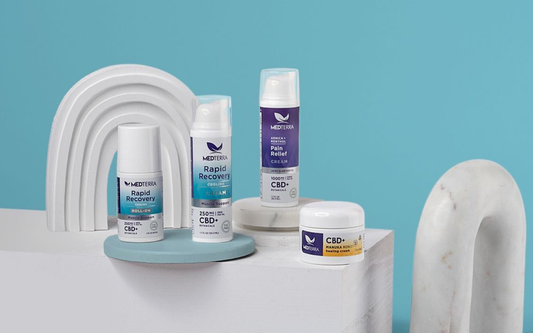 Front view of Medterra CBD products showing Rapid Recovery roll-on, Pain Relief, and Manuka honey cream on teal background