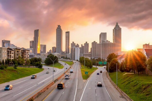Sunset over the Atlanta skyline with a multi-lane highway leading into downtown