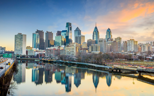 Philadelphia skyline reflecting on the Schuylkill River at sunset