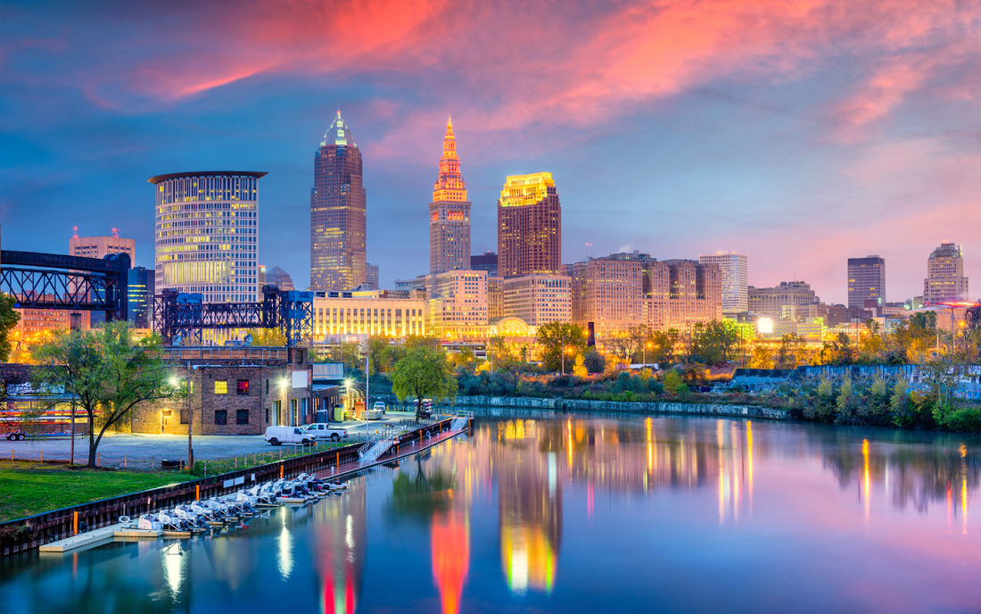 Cleveland skyline at sunset reflected on the Cuyahoga River