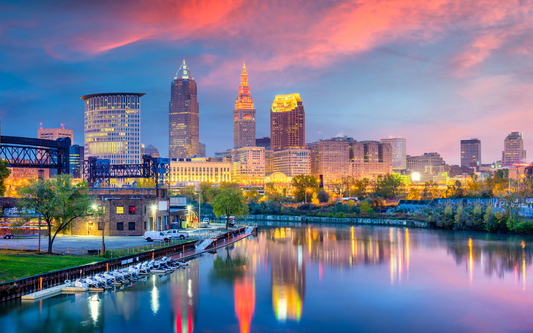 Cleveland skyline at sunset reflected on the Cuyahoga River