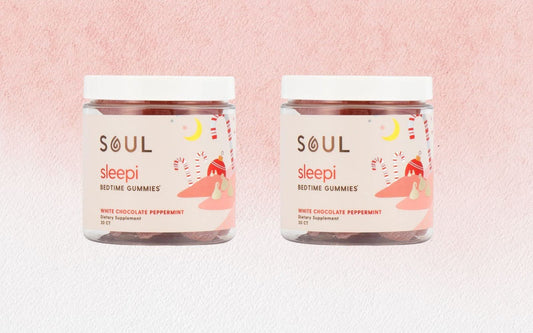 Front view of two Soul Sleepi Bedtime Gummies jars, white chocolate peppermint label, pink textured background