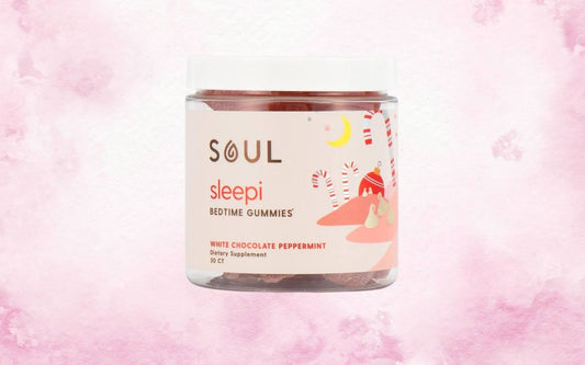 Front view of Soul Sleepi bedtime gummies jar showing white chocolate peppermint flavor and 30 CT label on pink watercolor background