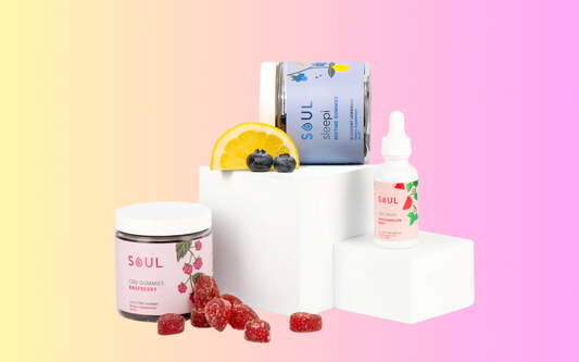 Front view of Soul CBD products showcasing raspberry gummies and Watermelon Mint drops on white display blocks