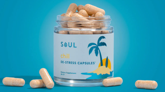 Front view of Soul Chill De-Stress Capsules jar showing label with palm-tree graphic and loose beige capsules on teal background