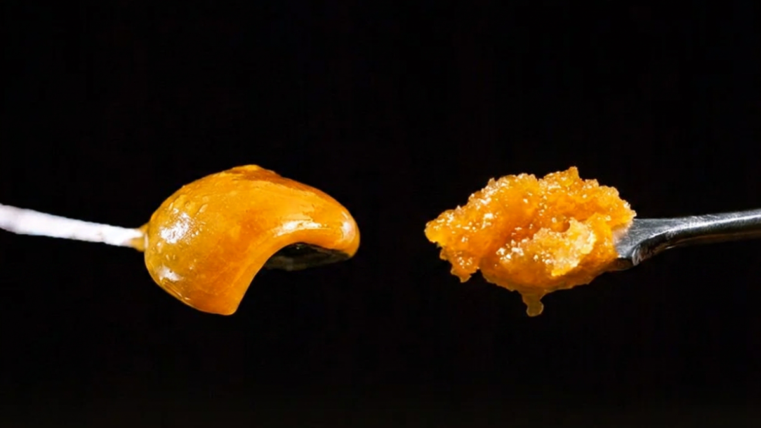 Close-up of two amber concentrates (rosin and resin): smooth glossy mound left, granular crumbly scoop right on a black background