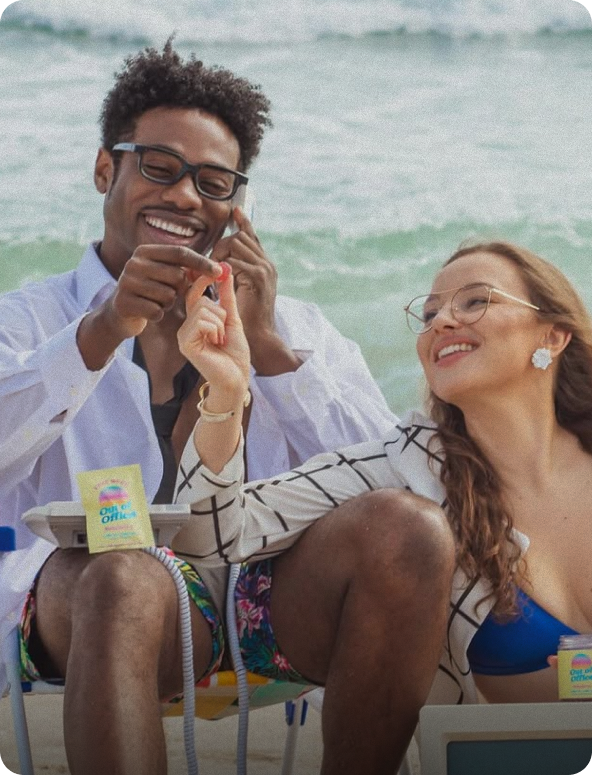 Friends laughing together on the beach