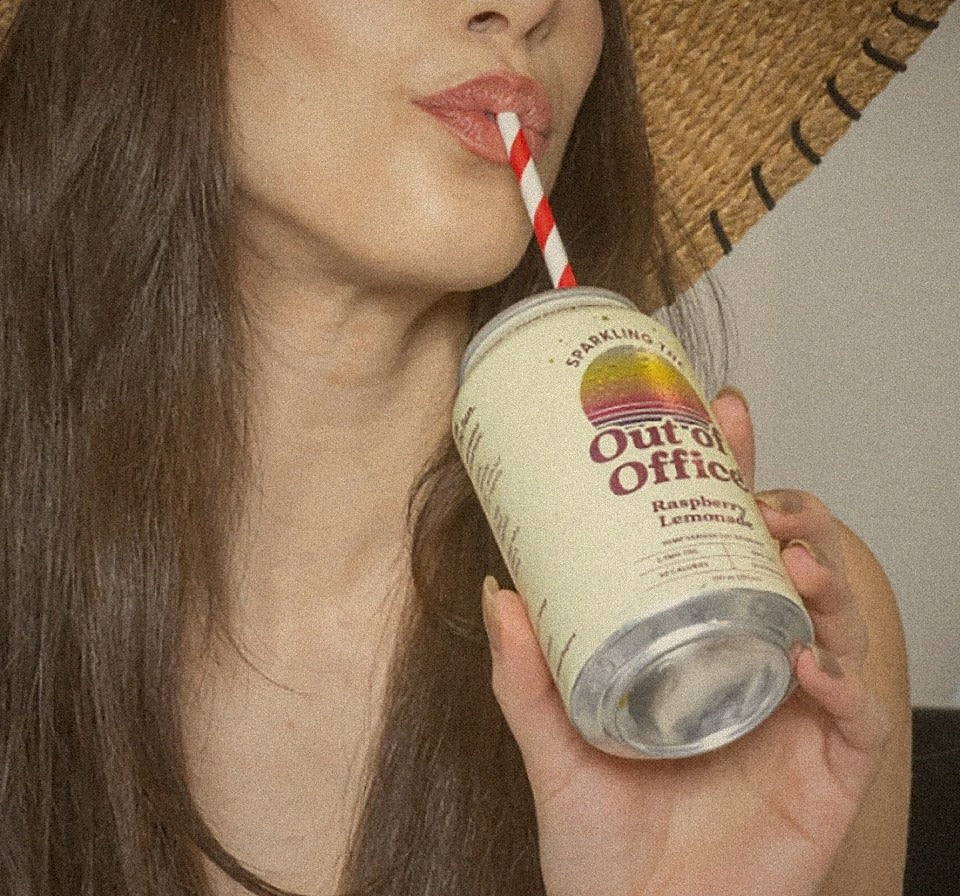 Friend sipping an Out of Office sparkling THC drink